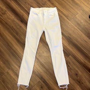 High-rise flare has an ankle-length inseam and a raw hem with stretch fabric